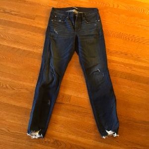 Distressed mid rise skinny jeans